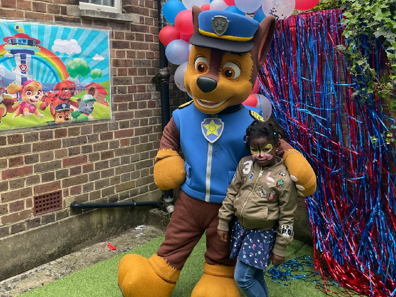 A child with one of the Paw Patrol team